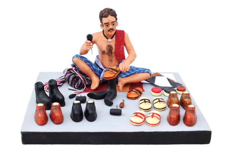 Shoemaker - Handmade Terracotta Clay Figurine | Prime Sitting Human Figure Idol