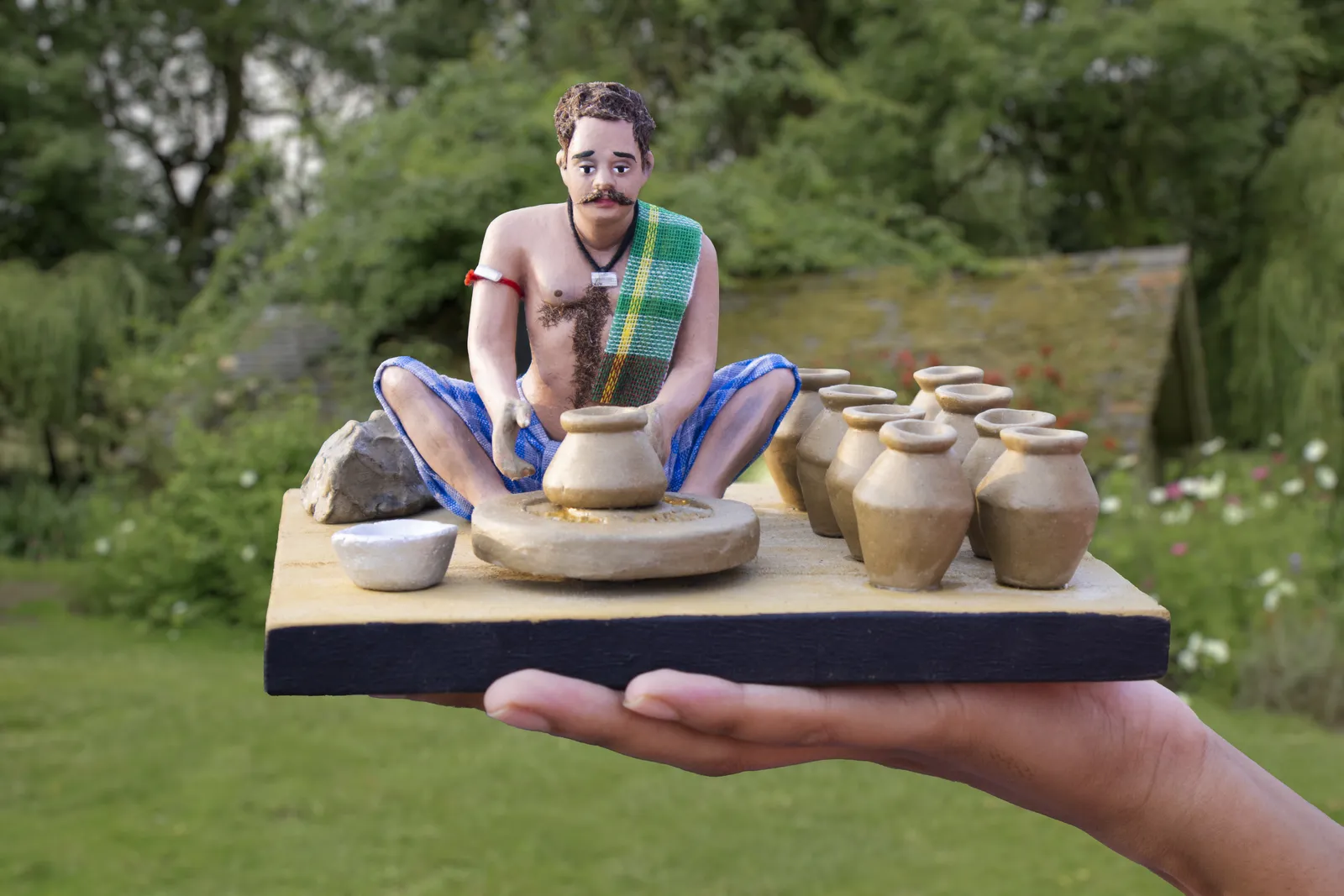 Potter - Handmade Terracotta Clay Figurine | Prime Sitting Human Figure Idol